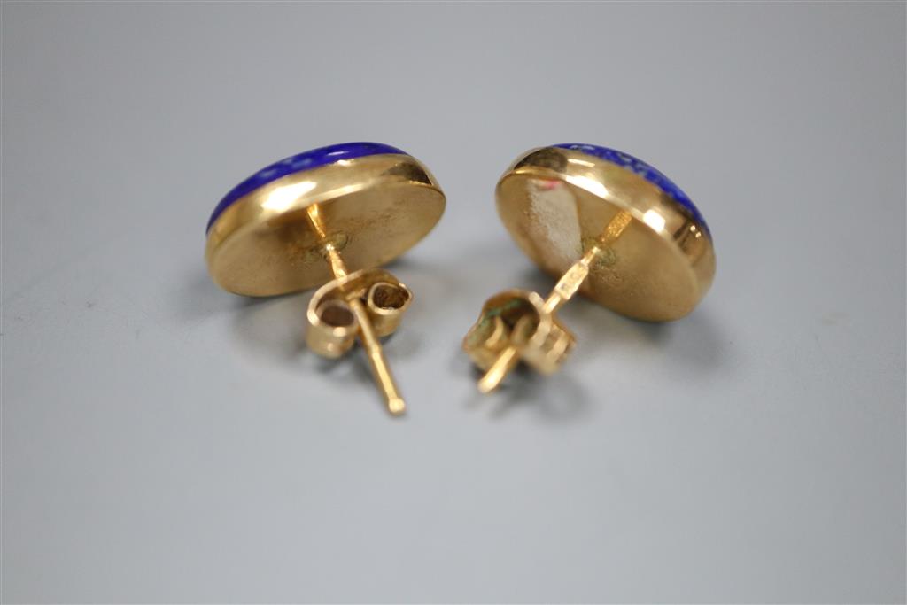 A Middle Eastern yellow metal and lapis lazuli oval dress ring, size N, and pair of matching earrings, gross 8.7 grams.